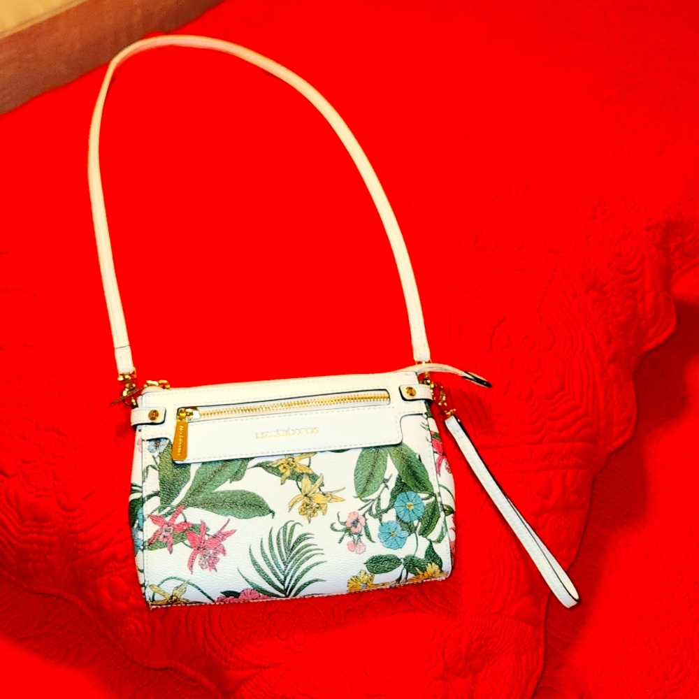 A small white and flower purse by Liz Claiborne or crossbody made of leather.$25